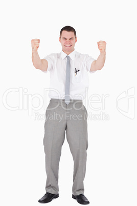 Portrait of a successful salesperson with fists up