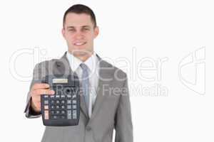 Businessman showing a calculator