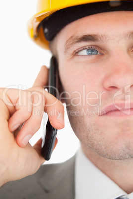 Close up of a young architect making a phone call