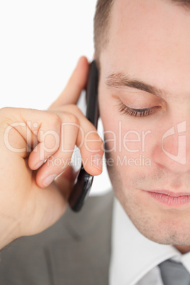 Close up of a sad businessman making a phone call