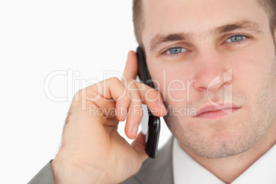 Close up of a focused businessman making a phone call