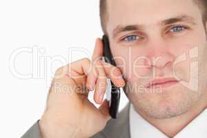 Close up of a focused businessman making a phone call