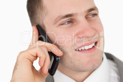 Close up of a handsome entrepreneur making a phone call