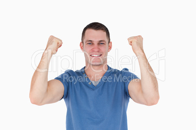 Smiling man with the fists up
