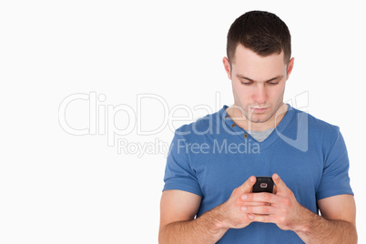 Young man sending text messages