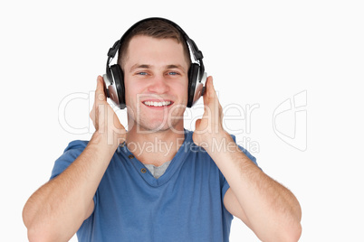 Smiling man listening to music