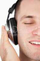Close up of a serene man listening to music