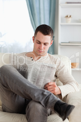 Portrait of a man reading a newspaper