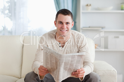 Man holding a newspaper