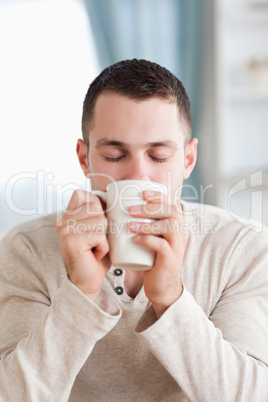 Portrait of a calm man having a coffee