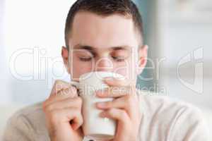 Calm man having a coffee
