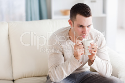 Young man having a coffee