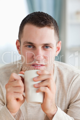 Portrait of a man having a tea