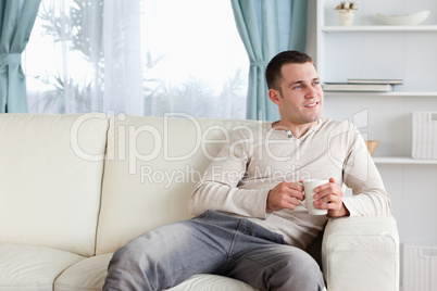 Attractive man having a coffee