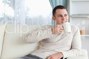 Attractive man having a tea