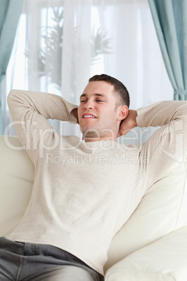 Portrait of a young man relaxing on a sofa