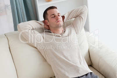 Man resting on a sofa