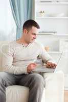 Portrait of a young man shopping online