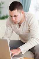 Portrait of a young man using a notebook