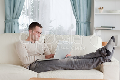 Man relaxing with a laptop