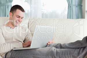 Man relaxing with a notebook