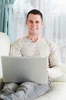 Portrait of a young man working with his notebook