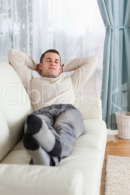 Portrait of man resting on a sofa