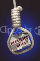 House Tied Up and Hanging in Hangman's Noose on Blue