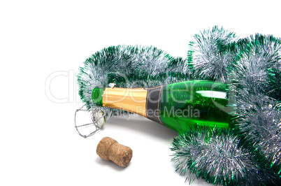 Empty bottle of champagne and Christmas tinsel
