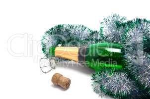 Empty bottle of champagne and Christmas tinsel