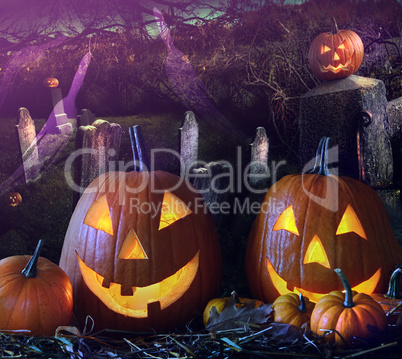 Halloween pumpkins in the grave yard