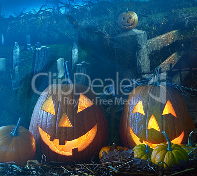 Halloween pumpkins in the grave yard