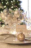 Elegant holiday dinner table with focus on place card
