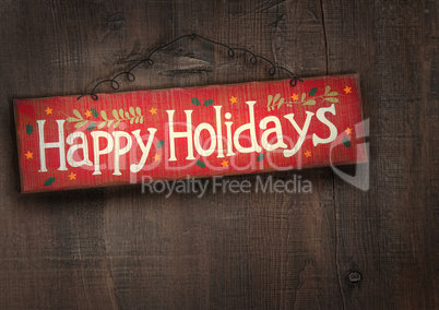 Holiday sign on distressed wood wall