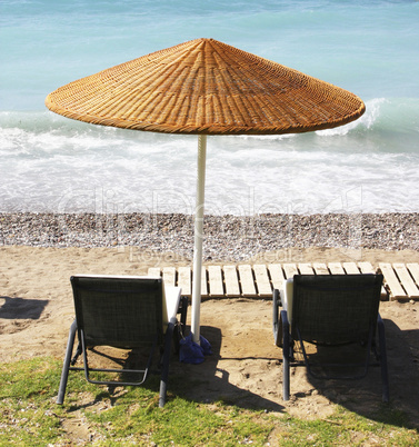 Beach chairs and umbrella