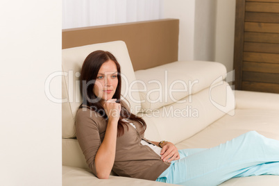 Attractive woman relax living room leather sofa