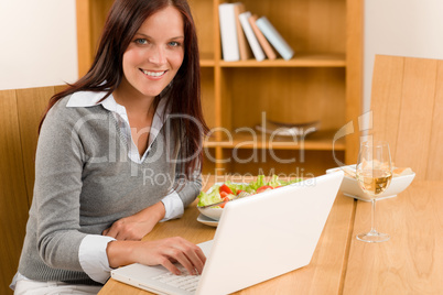 Home working lunch smiling woman with laptop