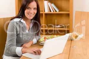 Home working lunch smiling woman with laptop