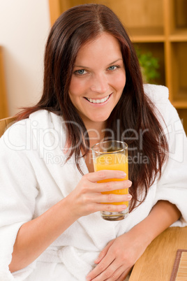 Breakfast - Smiling woman with fresh orange juice