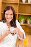 Breakfast - Smiling woman with cup of coffee