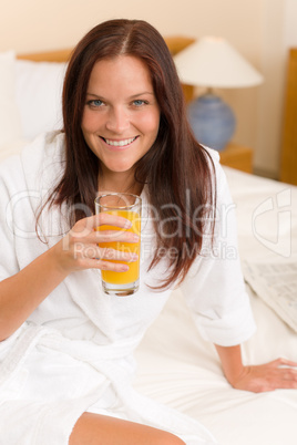 Breakfast - Smiling woman with fresh orange juice