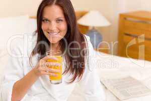 Breakfast - Smiling woman with fresh orange juice