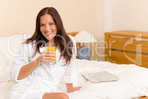 Breakfast - Smiling woman with fresh orange juice