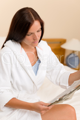 Attractive woman read morning newspapers bedroom