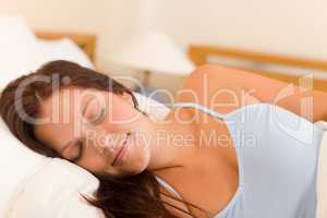 Sleeping beautiful woman portrait in white bed