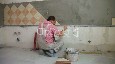 Worker installing Tiles