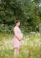 Pregnant woman with chamomile