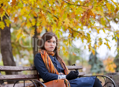 Young woman sitting on the bench