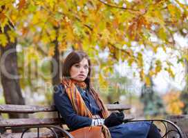 Young woman sitting on the bench