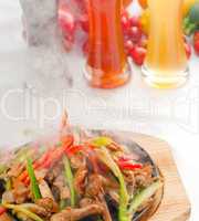 original fajita sizzling hot  on iron plate